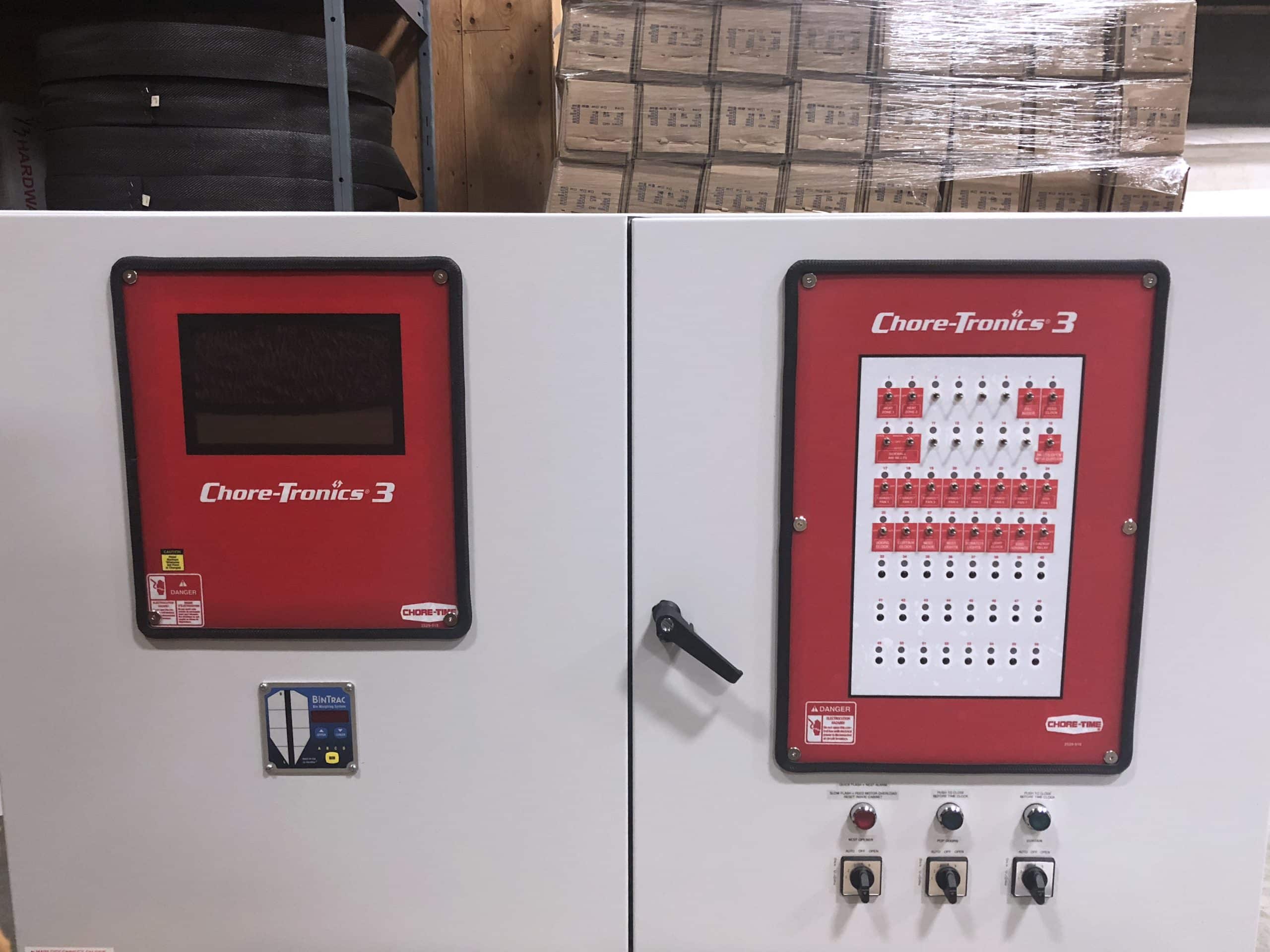 Control panel with ‘Chore-Tronics 3’ labels, featuring a screen, card reader, buttons, and indicator lights.